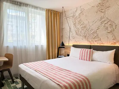 Ein Bett oder Betten in einem Zimmer der Unterkunft Nonanteneuf appart hōtel Sierre - contactless check-in