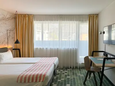 Ein Bett oder Betten in einem Zimmer der Unterkunft Nonanteneuf appart hōtel Sierre - contactless check-in