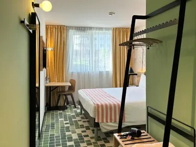 Ein Bett oder Betten in einem Zimmer der Unterkunft Nonanteneuf appart hōtel Sierre - contactless check-in
