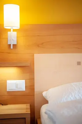 Ein Bett oder Betten in einem Zimmer der Unterkunft Hotel Gädi