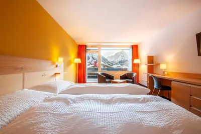Ein Bett oder Betten in einem Zimmer der Unterkunft Hotel Gädi