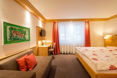 Ein Bett oder Betten in einem Zimmer der Unterkunft Hotel Alpbach
