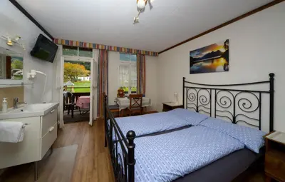 Ein Bett oder Betten in einem Zimmer der Unterkunft Swiss Lodge Hotel Bernerhof