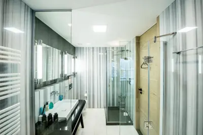 Ein Badezimmer in der Unterkunft Chalet Migui Luxury Living & Spa *****, Crans Montana