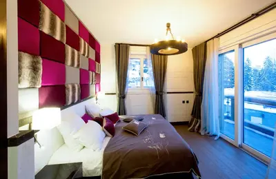 Ein Bett oder Betten in einem Zimmer der Unterkunft Chalet Migui Luxury Living & Spa *****, Crans Montana