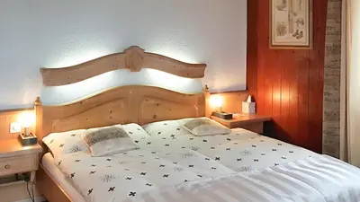 Ein Bett oder Betten in einem Zimmer der Unterkunft Hotel La Cambuse