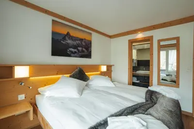 Ein Bett oder Betten in einem Zimmer der Unterkunft Hotel Matterhornblick