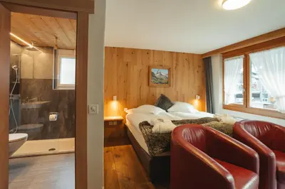Ein Bett oder Betten in einem Zimmer der Unterkunft Hotel Matterhornblick