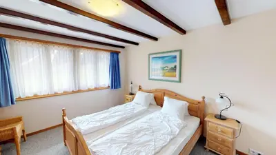 Ein Bett oder Betten in einem Zimmer der Unterkunft Christa CH0