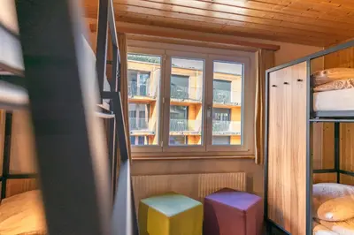 Ein Bett oder Betten in einem Zimmer der Unterkunft Eiger Lodge Easy