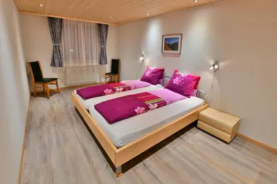 Ein Bett oder Betten in einem Zimmer der Unterkunft Ferienwohnung Alpenglühen
