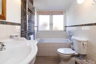 Ein Badezimmer in der Unterkunft Chalet Schweizerhof 1