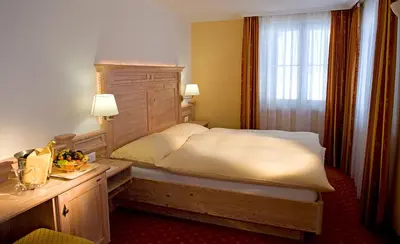 Ein Bett oder Betten in einem Zimmer der Unterkunft Hotel Restaurant Waldhaus
