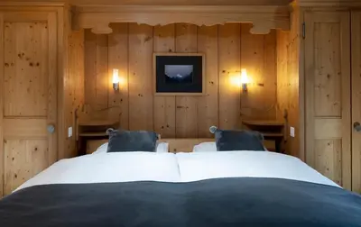 Ein Bett oder Betten in einem Zimmer der Unterkunft Hotel le Beausite
