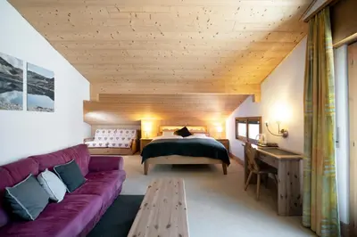 Ein Bett oder Betten in einem Zimmer der Unterkunft Hotel le Beausite