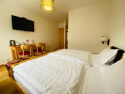 Ein Bett oder Betten in einem Zimmer der Unterkunft Qi-Lin Hotel Restaurant