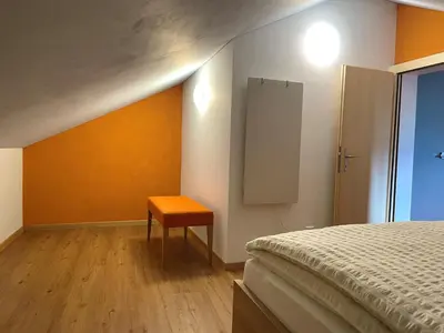 Ein Bett oder Betten in einem Zimmer der Unterkunft Boutique und Bier Hotel des alpes