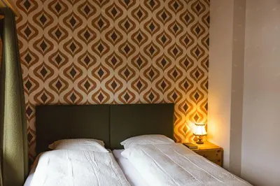 Ein Bett oder Betten in einem Zimmer der Unterkunft Waldhuus Bellary