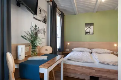 Ein Bett oder Betten in einem Zimmer der Unterkunft Interlaken Apartments