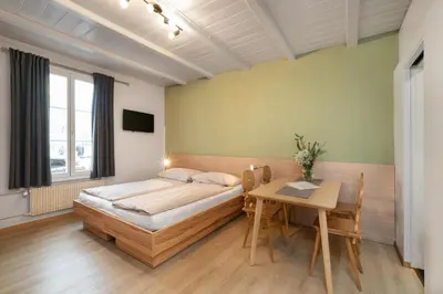 Ein Bett oder Betten in einem Zimmer der Unterkunft Interlaken Apartments