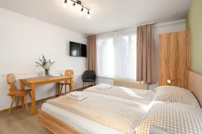 Ein Bett oder Betten in einem Zimmer der Unterkunft Interlaken Apartments