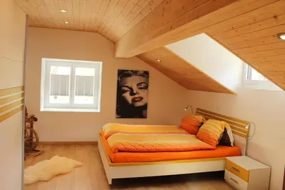 Ein Bett oder Betten in einem Zimmer der Unterkunft Haus Dorf 7
