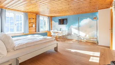Ein Bett oder Betten in einem Zimmer der Unterkunft Gasthaus Brünig Kulm