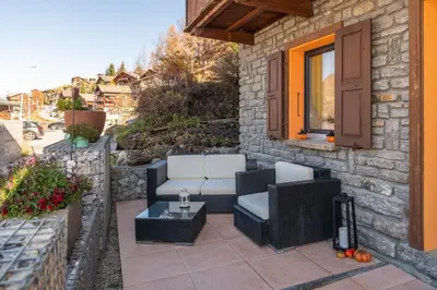 Ein Sitzbereich in der Unterkunft Chalet Ramona