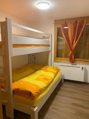 Ein Bett oder Betten in einem Zimmer der Unterkunft Chrinnengletscher