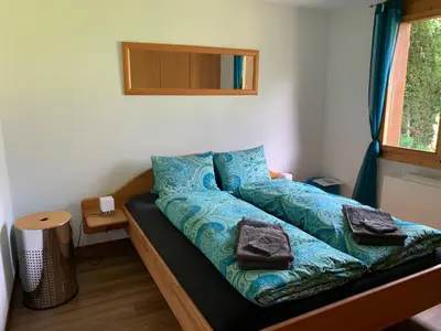 Ein Bett oder Betten in einem Zimmer der Unterkunft Chrinnengletscher