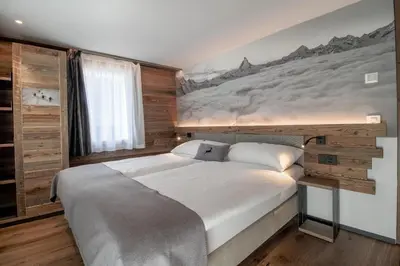 Ein Bett oder Betten in einem Zimmer der Unterkunft Alpine Lodge