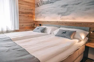 Ein Bett oder Betten in einem Zimmer der Unterkunft Alpine Lodge