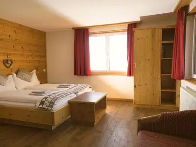 Ein Bett oder Betten in einem Zimmer der Unterkunft Hotel Aletschhorn