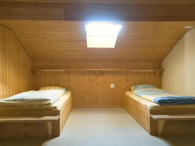 Ein Bett oder Betten in einem Zimmer der Unterkunft Hotel Aletschhorn