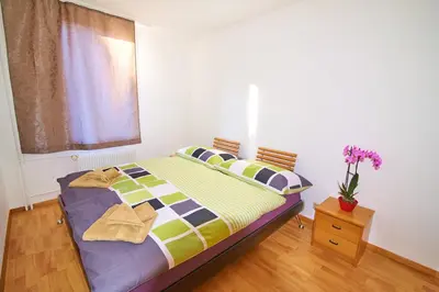 Ein Bett oder Betten in einem Zimmer der Unterkunft New West Station 7