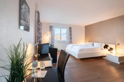Ein Bett oder Betten in einem Zimmer der Unterkunft Hotel Alpenhof