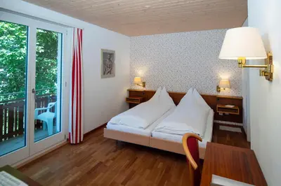 Ein Bett oder Betten in einem Zimmer der Unterkunft Hotel Berghaus