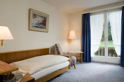 Ein Bett oder Betten in einem Zimmer der Unterkunft Hotel Berghaus
