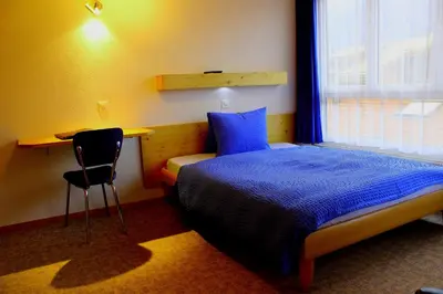 Ein Bett oder Betten in einem Zimmer der Unterkunft Hotel Alpha