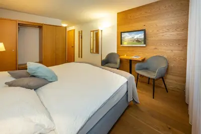 Ein Bett oder Betten in einem Zimmer der Unterkunft Hotel Bellwald