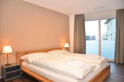 Ein Bett oder Betten in einem Zimmer der Unterkunft Apartment Flüehblüemli - GRIWA RENT AG