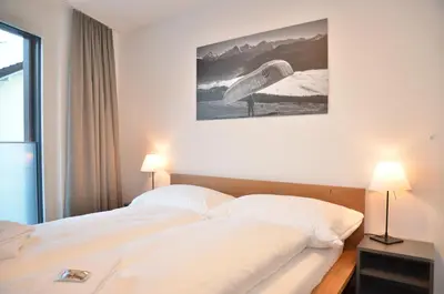 Ein Bett oder Betten in einem Zimmer der Unterkunft Apartment Edelwyss - GRIWA RENT AG