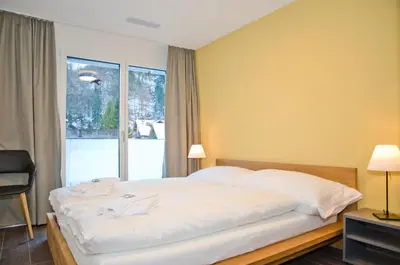 Ein Bett oder Betten in einem Zimmer der Unterkunft Apartment Ankebälleli - GRIWA RENT AG