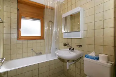 Ein Badezimmer in der Unterkunft Haus Rothorn, Swiss Alps