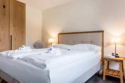 Ein Bett oder Betten in einem Zimmer der Unterkunft Apartment Alpeglöggli - GRIWA RENT AG