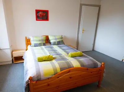 Ein Bett oder Betten in einem Zimmer der Unterkunft City Center Holiday Apartment