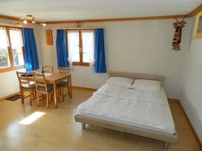 Ein Bett oder Betten in einem Zimmer der Unterkunft Apartment Studio Rinderbergblick by Interhome