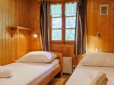Ein Bett oder Betten in einem Zimmer der Unterkunft Chalet Coquelicot by Interhome