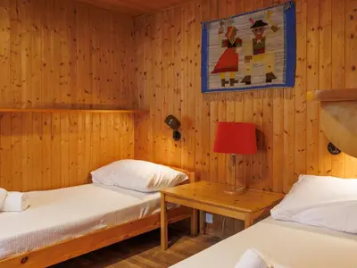 Ein Bett oder Betten in einem Zimmer der Unterkunft Chalet Coquelicot by Interhome