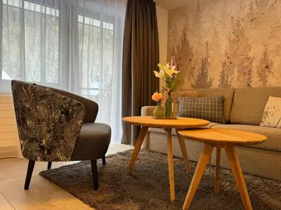 Ein Sitzbereich in der Unterkunft Hotel und Appartments Eden